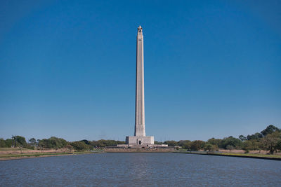 Low angle view of monument against blue sky