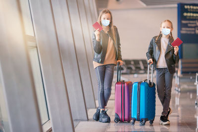 Woman standing against the wall
