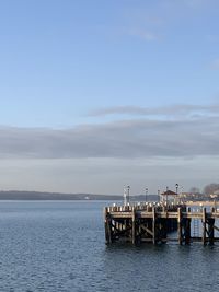 Pier on sea against sky