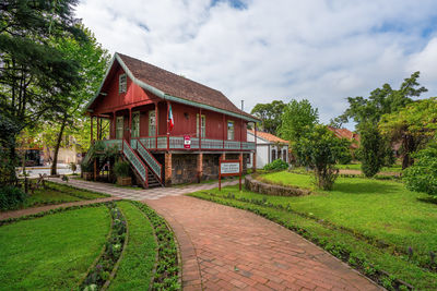 House on field against sky