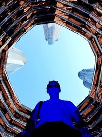 Low angle view of woman against sky