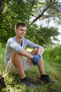 Young man resting after cleaning the park