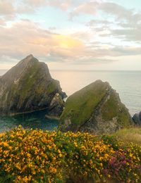 Scenic view of sea and rocks against sky