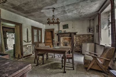 Chairs and table in abandoned room