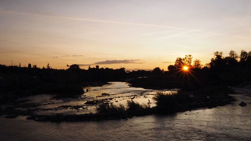 Scenic view of silhouette landscape against sky during sunset