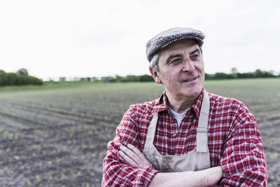 Portrait of farmer in front of a field