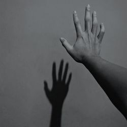 Shadow of hand on wall