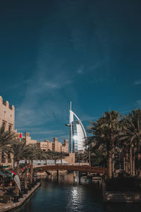 Bridge over river with buildings in background