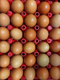 Full frame shot of brown eggs