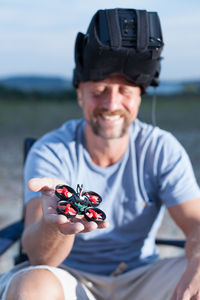 Man with drone on field