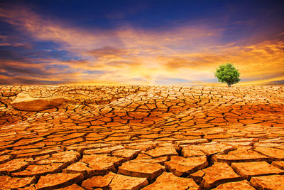 Scenic view of desert land against sky