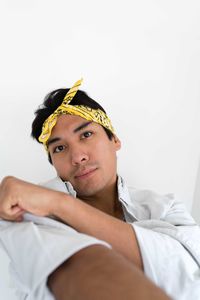 Portrait of hispanic man wearing yellow bandana