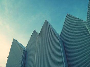 Low angle view of buildings against blue sky