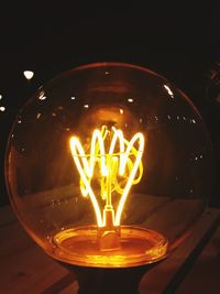 Close-up of illuminated light bulb