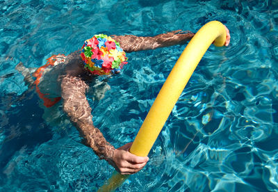 High angle view of man swimming in pool