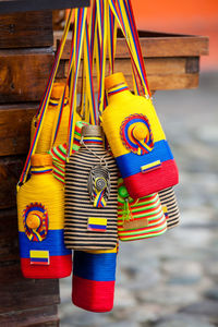 Liquor bottles used for traditional aguardiente decorated with the colors of the colombian flag