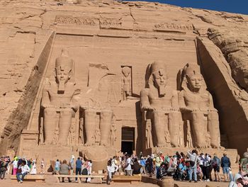 Group of people walking on rock formations