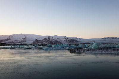 Scenic view of frozen lake against sky