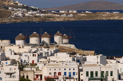 Windmills on the hill of mykonos island and aegean sea