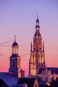 View of illuminated building against sky at dusk