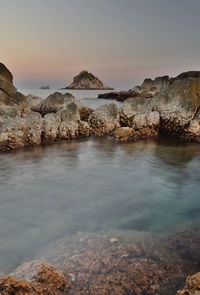 Scenic view of sea against sky during sunset
