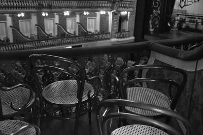 High angle view of empty chairs and tables in cafe