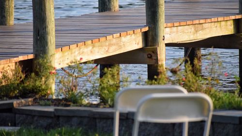 Chairs and table by water