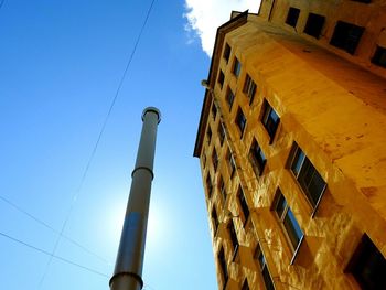 Low angle view of buildings against blue sky