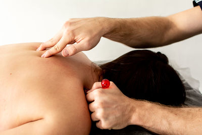 Physiotherapist working on patient's shoulder injury treatment.