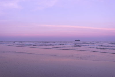 Scenic view of sea against sky at sunset