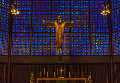 Low angle view of illuminated statue in building