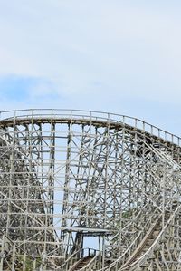 Low angle view of rollercoaster against sky