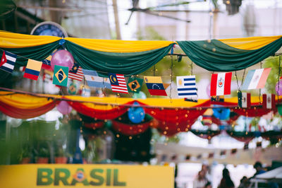 Close-up of small flags hanging on string