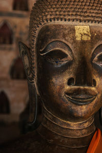 Close-up of buddha statue in temple