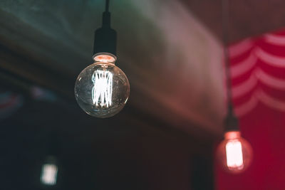 Low angle view of illuminated light bulb