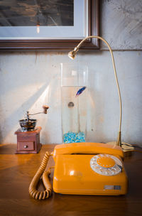 Tea light on table at home