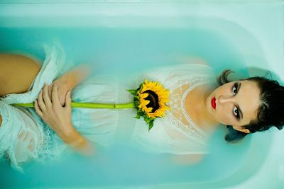 Portrait of young woman in swimming pool