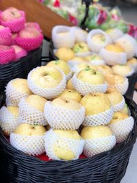 High angle view of fruits in basket at market stall