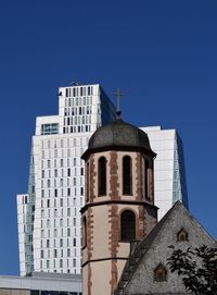 Low angle view of building against clear blue sky