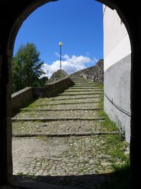 Low angle view of staircase against blue sky