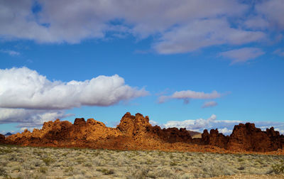 Panoramic view of rocks on land against sky