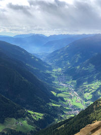 Aerial view of valley and mountains against sky