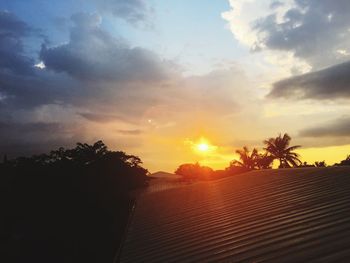 Scenic view of landscape against sky at sunset