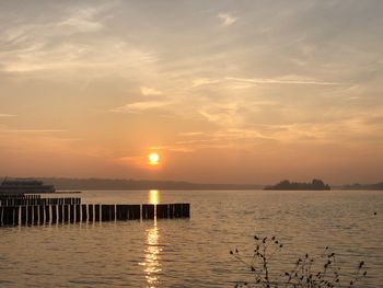 Scenic view of sea against sky during sunset