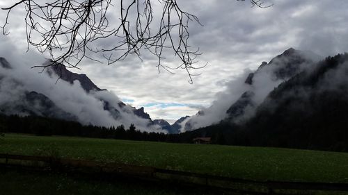 Scenic view of landscape against cloudy sky