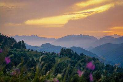 Scenic view of mountains against sky during sunset