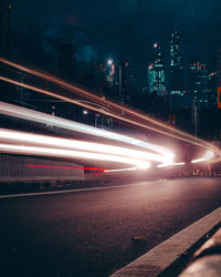 Light trails on road at night in city