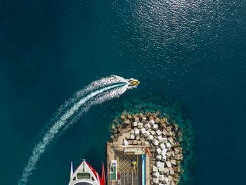 Ship sailing in sea against sky