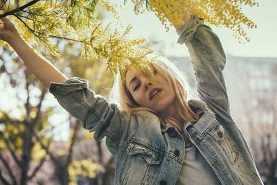 Yellow, spring, bokeh, lifestyle, arms, trendy, blonde, denim jacket,