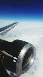 Close-up of airplane wing against sky